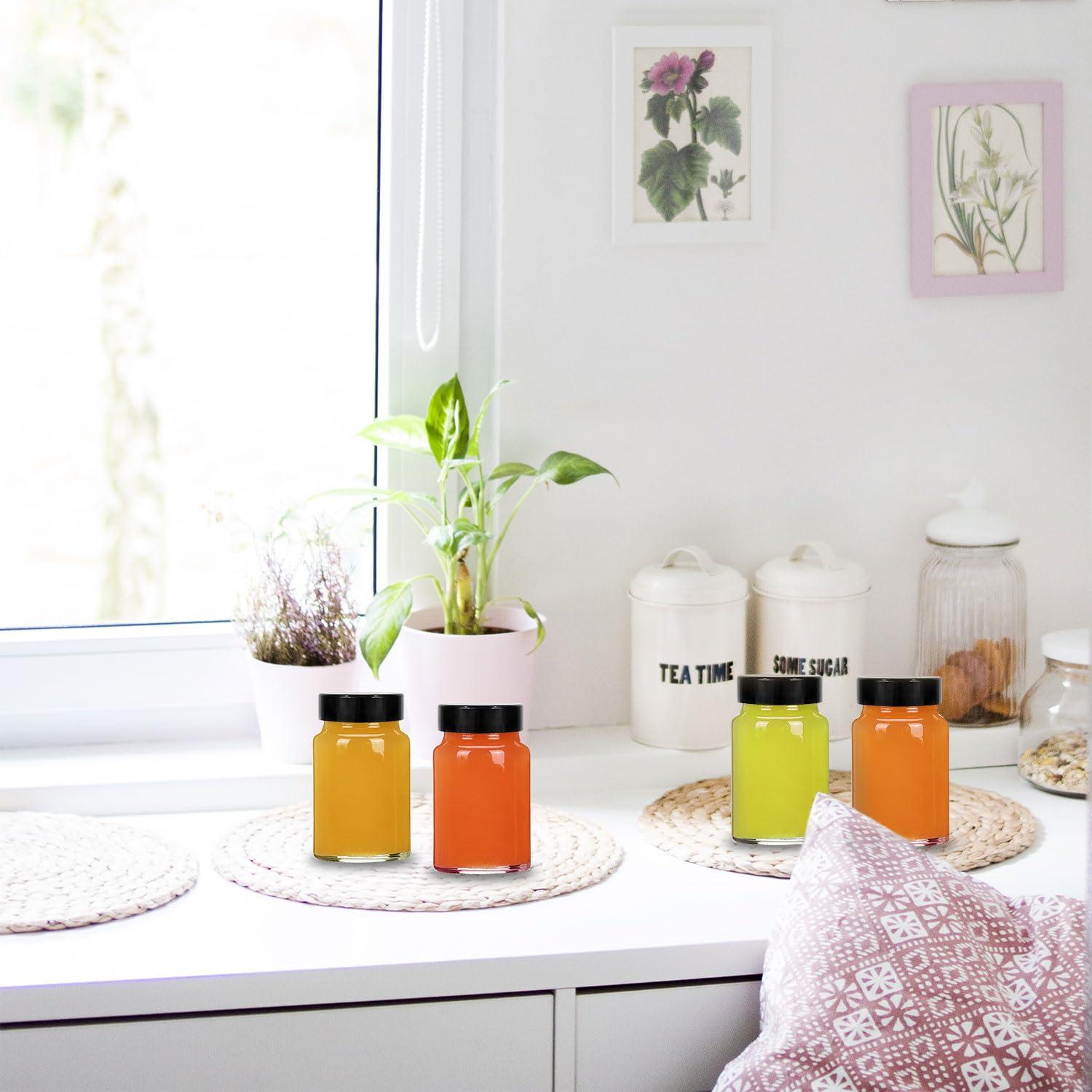 LANBEAUTIFY 2 oz Small Clear Glass Bottles with Lids - 12 Pcs Wide Mouth Shot Bottles with Caps for Ginger Shots, Juice, Potion, Liquids, Whiskey - Mini Travel Bottles with Funnels, Stickers (12PCS-Clear)